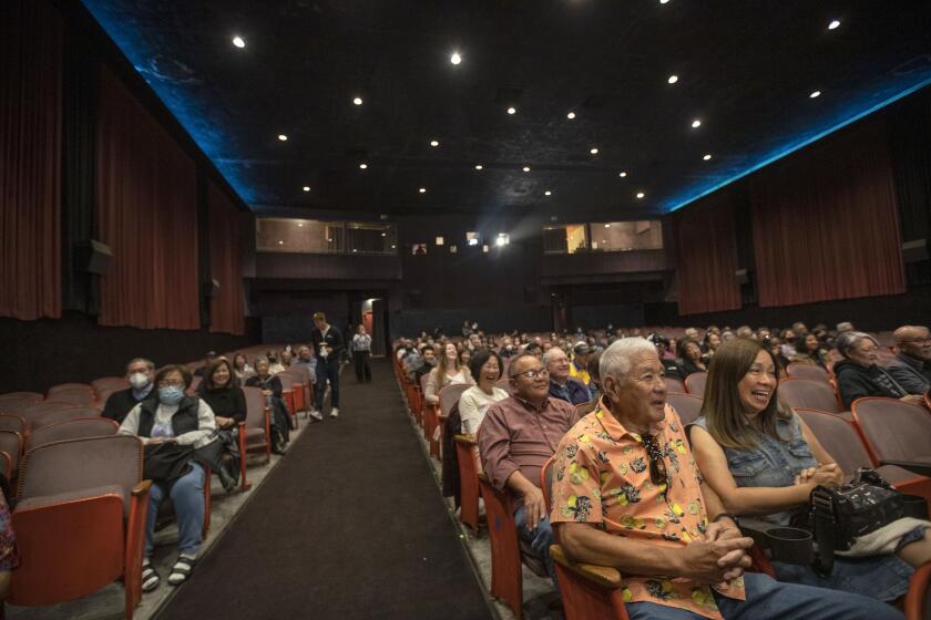 GARDENA, CA-MAY 10, 2023: People sit inside the 800 seat Gardena Cinema before a screening of the movie, "No NO Girl," part of the Los Angeles Asian Pacific Film Festival. The community is rallying around the theater as its owner ponders its future. (Mel Melcon / Los Angeles Times)