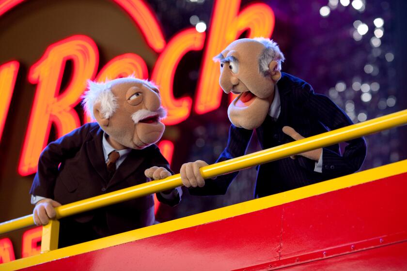 Statler and Waldorf - movie THE MUPPETS THEY MADE ANOTHER MUPPET MOVIE? STATLER and WALDORF may not be in the balcony but it doesnOt stop them from heckling their fellow Muppets in THE MUPPETS. (Opening in theaters Nov. 23rd). Ph: Scott Garfield ©2011 Disney Enterprises, Inc. All Rights Reserved.