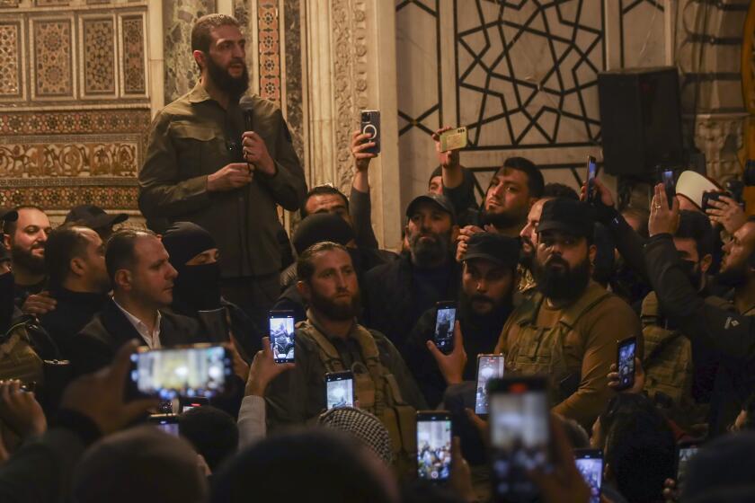 Abu Mohammed al-Golani speaks at the Umayyad Mosque in Damascus Sunday Dec. 8, 2024. Golani, a former al-Qaida commander who cut ties with the group and says he embraces pluralism and religious tolerance, leads the biggest rebel faction and is poised to chart the country's future. He calls himself by his given name, Ahmad al-Sharaa, and not his nom de guerre.(AP Photo/Omar Albam)