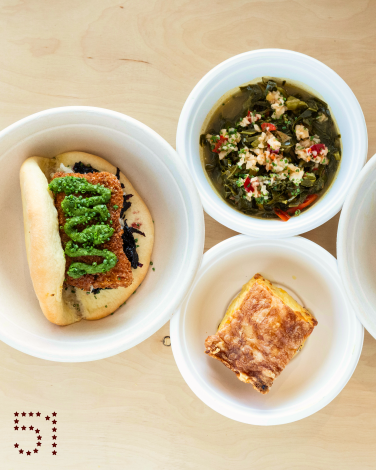 LOS ANGELES, CA - OCTOBER 24: Cocobread cutter sandwich, left; callaloo, top; curry shrimp roti and mac and cheese pie at Bridgetown Roti in Los Angeles, CA. Photographed on Thursday, Oct. 24, 2024. (Myung J. Chun / Los Angeles Times)