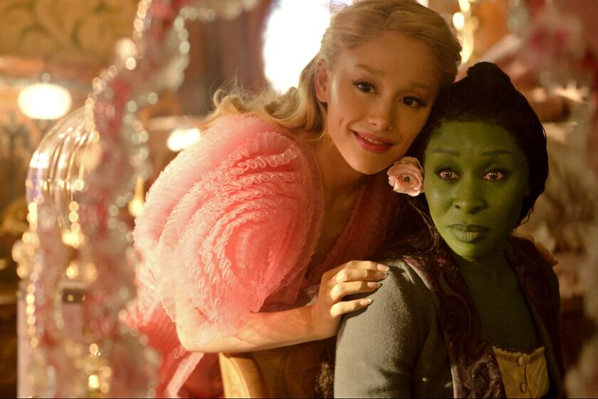 L to R: Ariana Granda is Glinda and Cynthia Erivo is Elphaba in WICKED, directed by Jon M. Chu