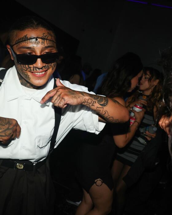 Los Angeles, CA - July 27: Lil Frisky Boy dances alongside Luna during the Night of the Blaxican event at Alpha Studios Production Lot on Saturday, July 27, 2024 in Los Angeles, CA. (Michael Blackshire / Los Angeles Times)