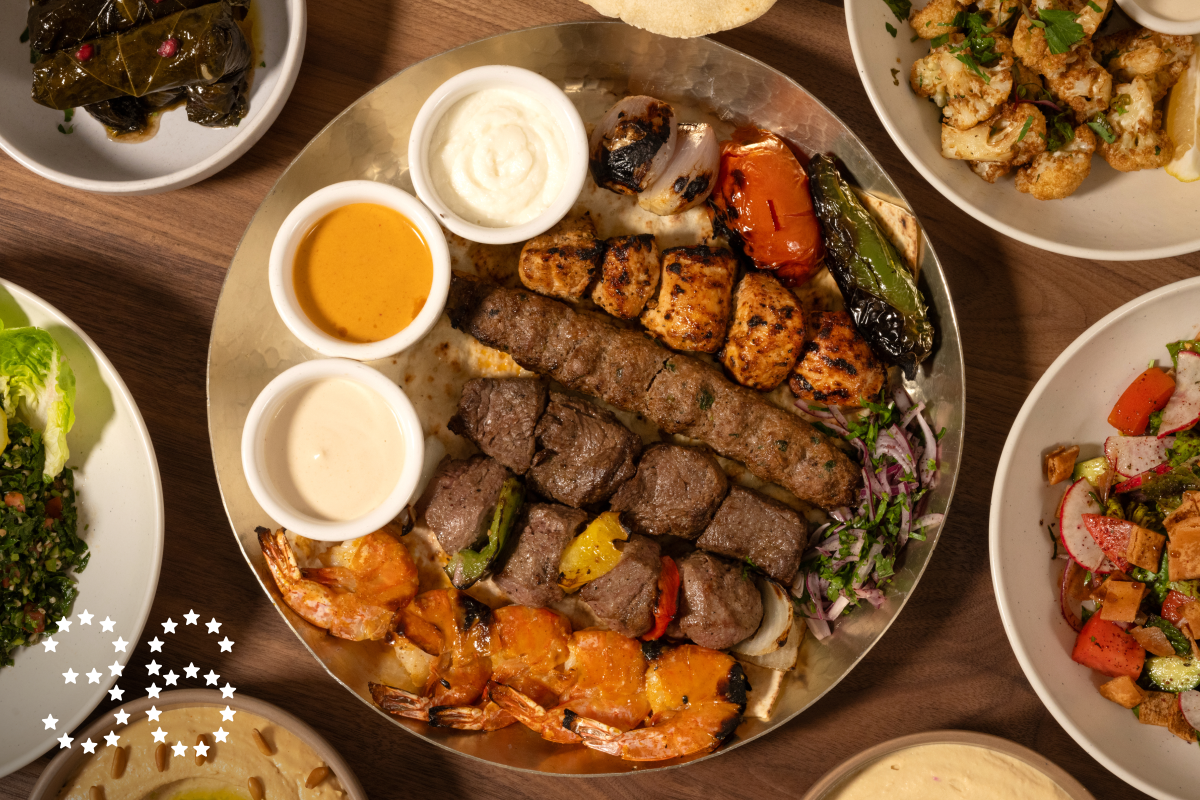 LONG BEACH, CA - OCTOBER 30, 2024: Family Mashawi Feast at Ammatoli in Long Beach with 6 kebabs and grilled veggies. Served with vermicelli rice, two sides, and one large salad (fattoush, greek, tabbouleh) (Ron De Angelis / For The Times)