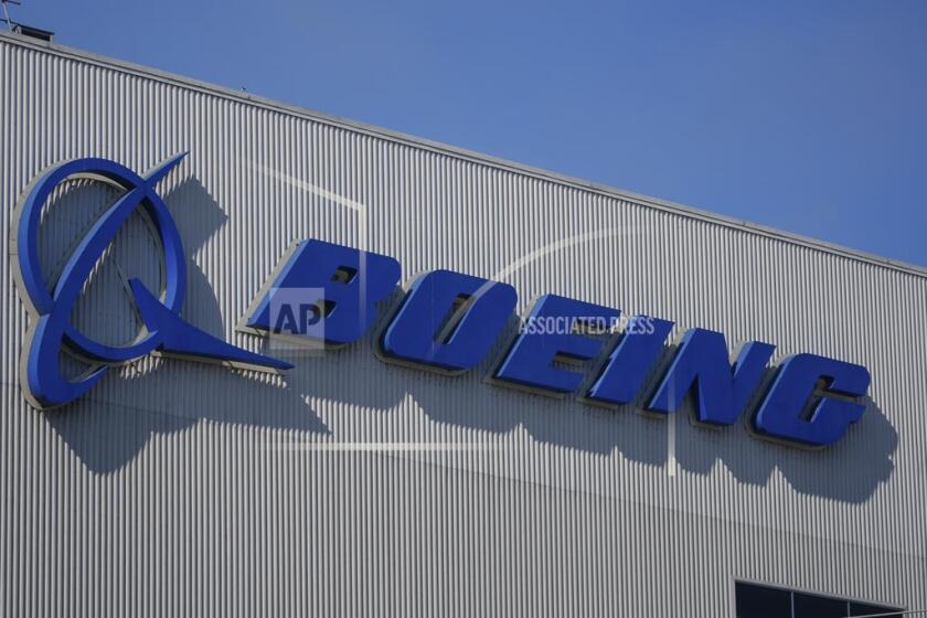 FILE - The Boeing logo is displayed at the company's factory Tuesday, Sept. 24, 2024, in Renton, Wash. (AP Photo/Lindsey Wasson, File)